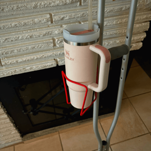Lightweight aluminum crutch cup holder with a drink container for hands-free hydration on crutches.