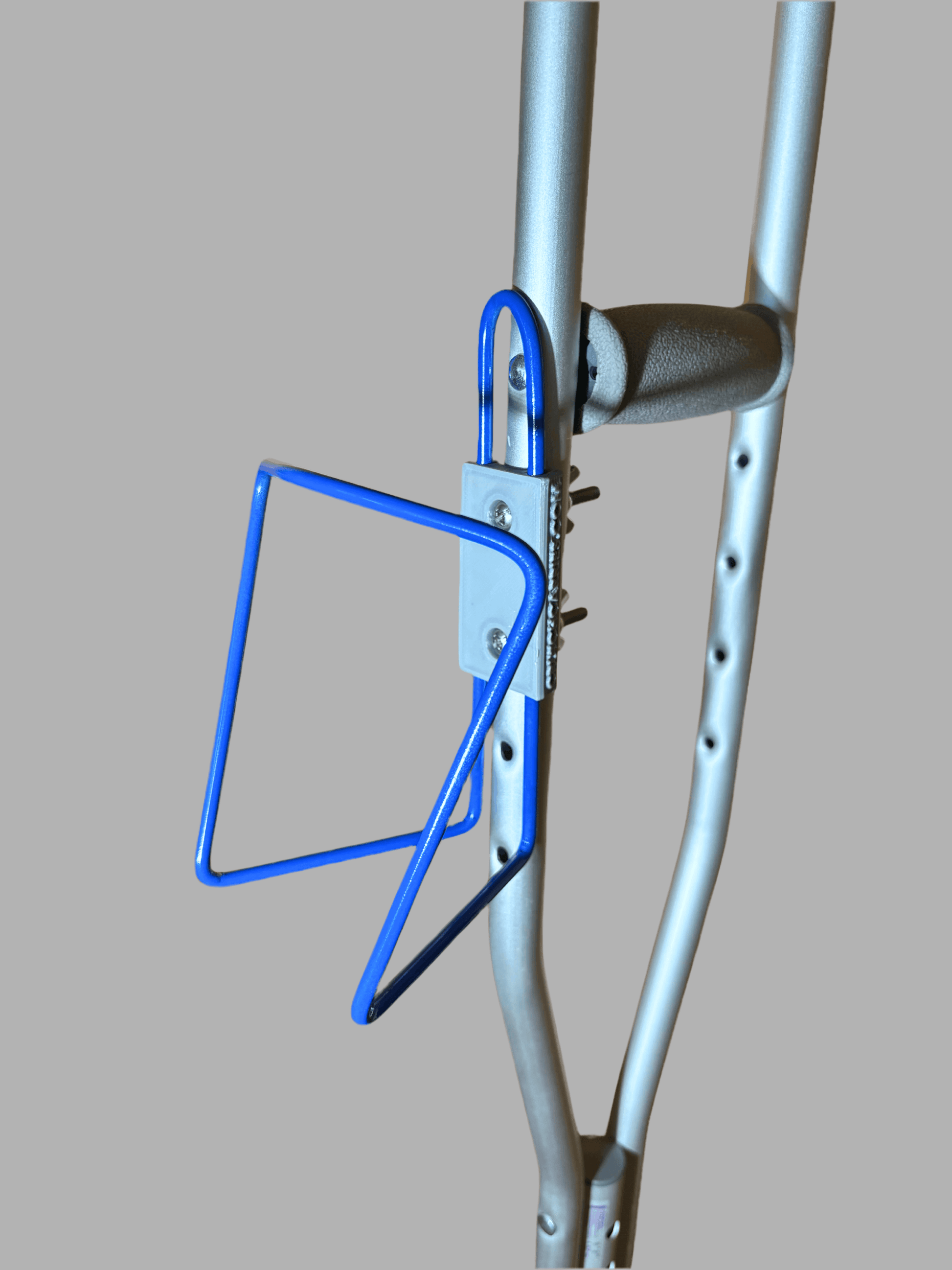 Durable aluminum crutch cup holder designed to bolt onto crutches, accommodating drink containers with a 3-inch base.
