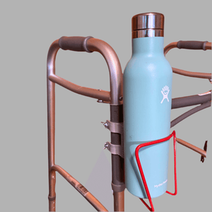 Walker cup holder with a blue drink bottle securely attached, enhancing mobility and hydration for users.