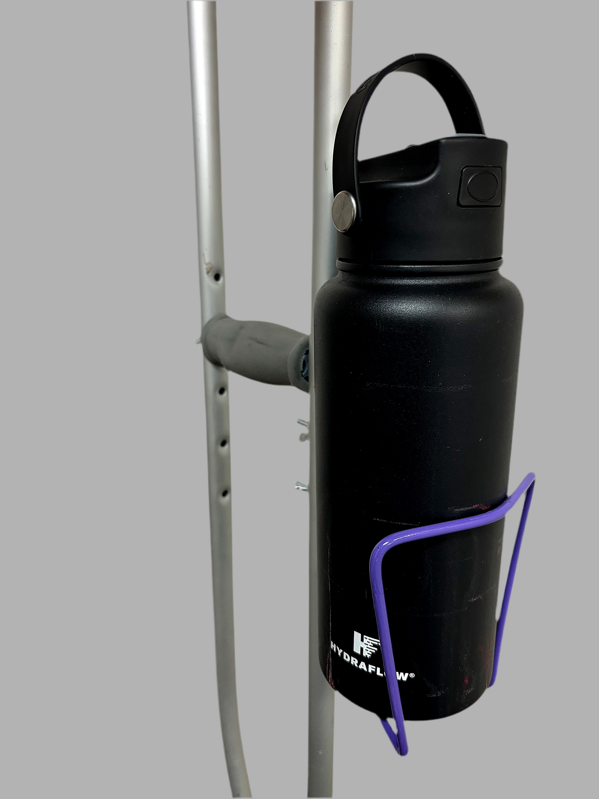 Durable aluminum crutch cup holder with a black water bottle attached, designed for versatility and easy bolting.