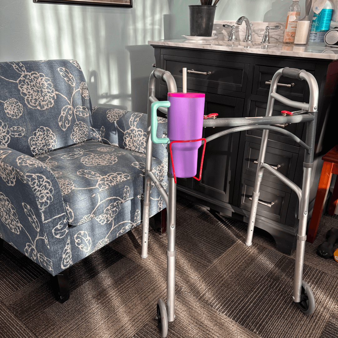 walker cup holder aluminum drink holder for walkers attached to a walker with a purple drink in it.
